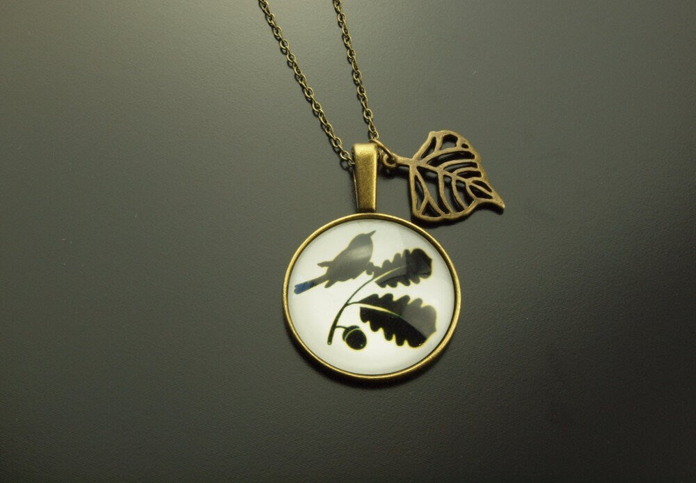 Kette bronze Cabochon Zweig schwarz weiß Vogel