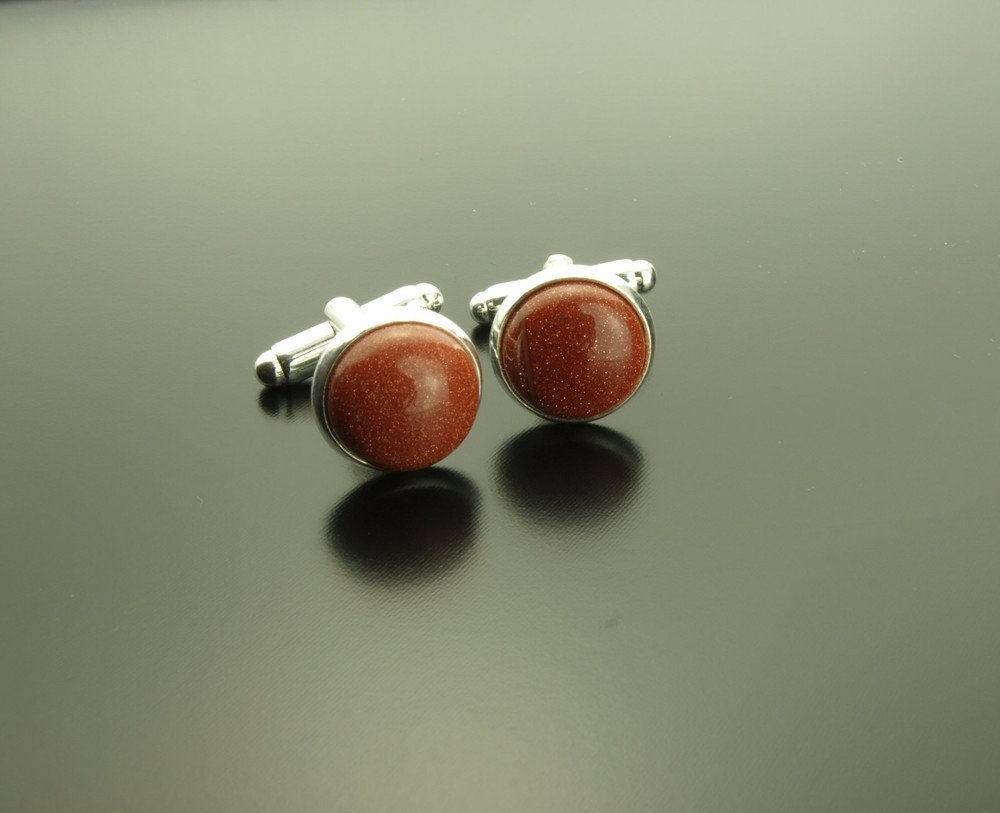 Manschettenknopf Edelstein Goldfluss rot Cabochon