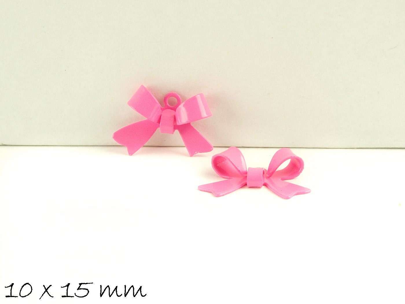 4 Stück Schleife Anhänger Messing rosa 10 x 15 mm