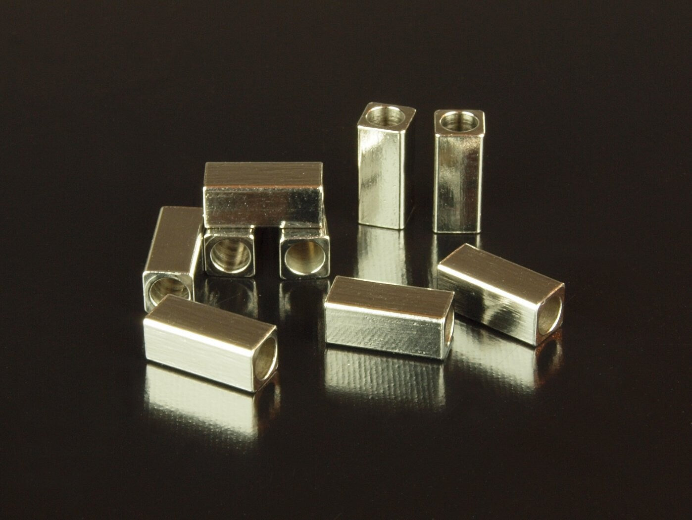 10 Stück Spacer Perlen aus Edelstahl 7 x 3 x 3 mm in silber