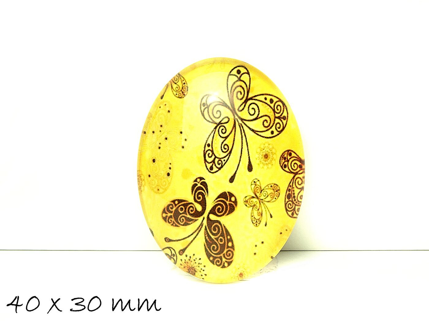 1 Stück beklebter Glas Cabochon, gelb, Schmetterlinge, 40 x 30 mm