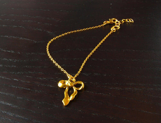 Armreifen Kette Anhänger Schleife gold Bettelkette