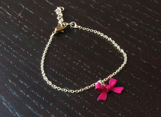 Armreifen Kette Anhänger Schleife pink Bettelkette