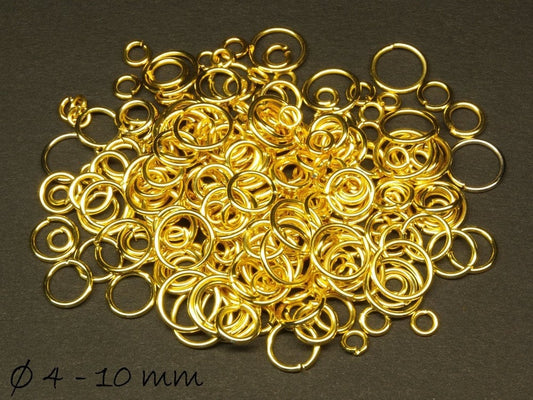 0,06EUR/g - 25 g  Biegeringe (120 - 150 Stk.), gold 4 - 10 mm